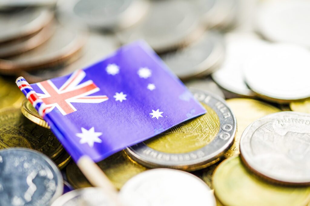 Australia flag coins finance investment economy concept scaled.jpg